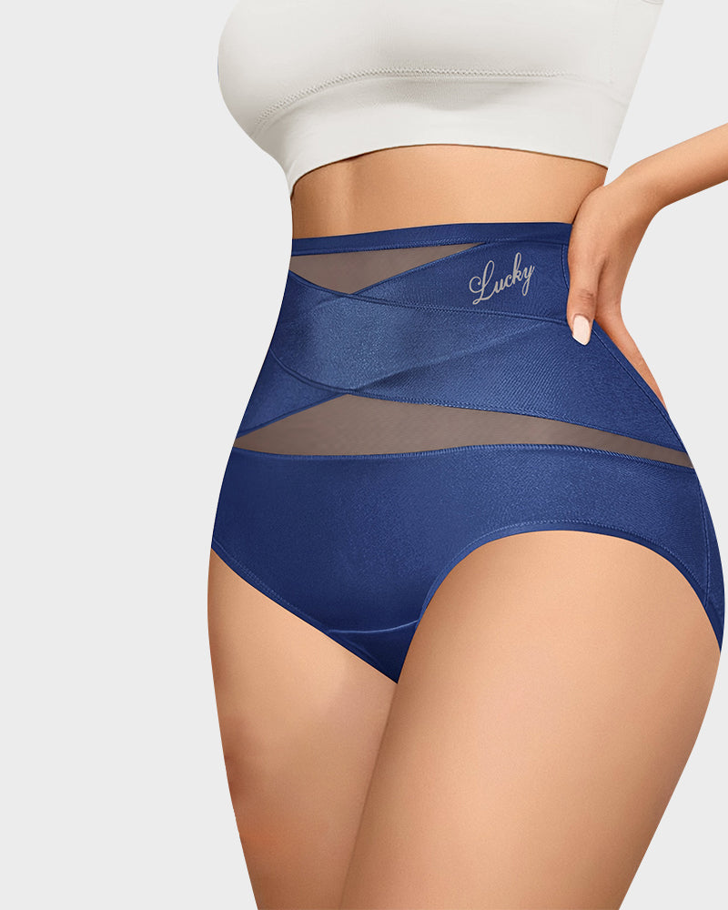Model wearing navy cross-panel high-waist briefs, front view