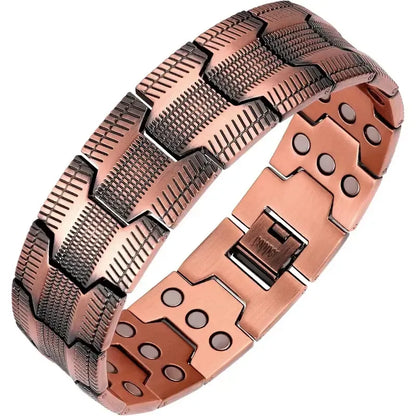 Wide copper-tone textured link bracelet showing inner magnets and clasp